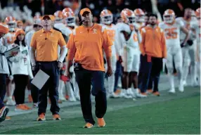  ?? AP ?? Tennessee coach Josh Heupel checks the scoreboard during the second half of the Volunteers’ loss to South Carolina on Saturday night in Columbia, S.C.