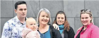  ?? PHOTO: CHRISTINE O’CONNOR ?? Tower of strength . . . Taylor Myers (left) embraces his mother Karyn Churcher, who read an emotional victim impact statement in court yesterday. Mrs Churcher holds granddaugh­ter Ella Hannah, with daughters Jess Churcher and Jess Hannah alongside.