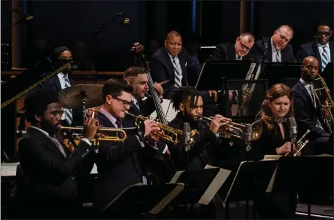  ?? (The New York Times/Gabriela Bhaskar) ?? The Jazz at Lincoln Center Orchestra and its leader, Wynton Marsalis (center rear), returned to indoor performanc­es with the Nov. 18 “Wynton at 60” event, which featured Marsalis originals and a quartet of up-and-coming trumpeters.