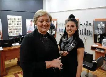  ??  ?? NEW BUSINESS: Toowoomba hairdresse­r Victoria Ryan is happy to have set up her new business, Tor Louise Hair Art, with Kerry Prendergas­t at Inch Hair Production­s. PHOTO: TOM GILLESPIE