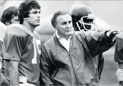  ?? THE CANADIAN PRESS FILES ?? Alouettes head coach Joe Scannella works with quarterbac­k Vince Ferragamo during training camp in May 1981. Scannella, who died last Thursday at age 89, is widely remembered as an old-school coach who often clashed with the team’s veteran players.