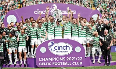  ?? ?? Celtic celebrate their 10th title in 11 years in front of the fans Celtic