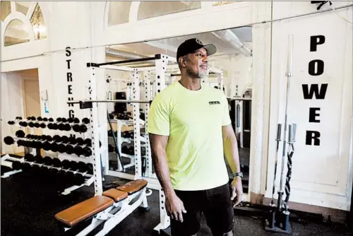  ?? CHRIS SWEDA/CHICAGO TRIBUNE ?? Nairobi Evans stands inside The Space, a gym in Chicago’s Hyde Park neighborho­od Feb. 18. Evans, who made an earning as a personal trainer, has seen his business suffer because of the pandemic. He joined a workforce developmen­t program offered by the Chicago Urban League, where he is looking for jobs in project management.