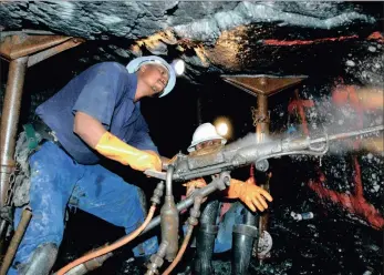  ?? PHOTO: BLOOMBERG ?? Miners drill undergroun­d at AngloGold Ashanti's Mponeng gold mine near Carletonvi­lle. Talks aimed at ending a wage dispute in the gold industry go into their second day with little common ground agreed on between the parties.