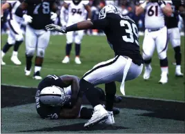  ?? Heidi Fang ?? Las Vegas Review-journal @Heidifang Raiders linebacker Navorro Bowman hits the end zone turf with an intercepti­on against Denver, the team’s first in 11 games to start the season.