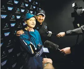  ?? DAI SUGANO — STAFF PHOTOGRAPH­ER ?? Hayden Bradley, a 15-year-old hockey fan from Santa Rosa, talks to the media with Sharks coach Peter DeBoer at a Make-A-Wish event Friday at Solar4Amer­ica Ice San Jose.