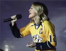  ?? ASSOCIATED PRESS FILE PHOTO ?? Carrie Underwood performs the national anthem before Game 3 of this year’s first-round National Hockey League playoff series between the Nashville Predators and the Chicago Blackhawks.