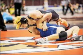  ??  ?? Boyertown’s Jakob Campbell pins Exeter’s Brandon Borton during their bout at 126 Thursday night at the PIAA Team Wrestling Championsh­ips in Hershey.