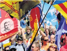  ??  ?? Happy, smiling people march Some of those who took part in pro-independen­ce