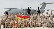  ?? — Reuters ?? Spanish Air Force personnel pose for a picture ahead of a mission to deliver humanitari­an aid to the Gaza Strip, in the Zaragoza Air Base, Spain.