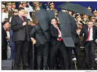  ?? AP/Xinhua ?? Security workers surround Venezuelan President Nicolas Maduro on Saturday during a speech in Caracas.