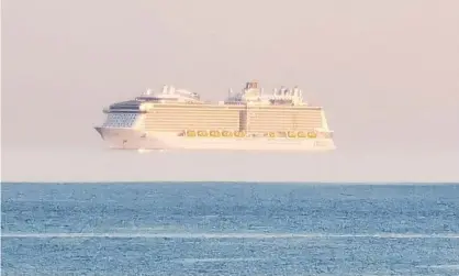  ?? Photograph: Triangle News/Ryan Rushforth ?? The cruise ship Anthem of the Seas appears to hover in mid-air on Wednesday evening close to Bournemout­h Pier.