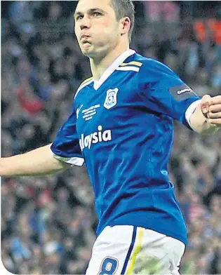  ??  ?? Don Cowie celebrates scoring for Cardiff City in the penalty shoot-out in 2012