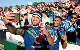  ?? GETTY IMAGES ?? Warriors team-mates Jazz Tevaga, left, and Marcelo Montoya celebrate victory over the Dragons with fans yesterday.