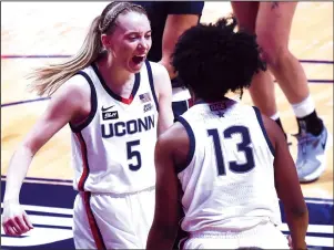  ?? BRAD HORRIGAN/HARTFORD COURANT/TNS ?? UConn sophomore Paige Bueckers, left, has over 829,000 followers on Instagram, 335,000 on TikTok and another 51,000 on Twitter, making her one of the most followed athletes, male or female, in American college sports.