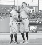  ?? MICHAEL LAUGHLIN/STAFF PHOTOGRAPH­ER ?? Giancarlo Stanton reacts to being caught off first base in the first inning of Tuesday’s game.