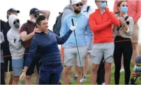  ?? ?? Rory McIlroy struggling in the wind on day two. Photograph: David Cannon/Getty Images