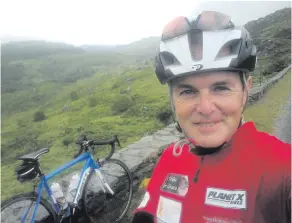  ??  ?? On his bike: Stephen takes a break while out training for his marathon charity cycle