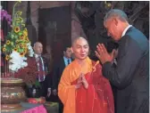  ?? JIM WATSON, AFP/GETTY IMAGES ?? President Obama pays respects Tuesday during a visit with Abbot of the Jade Emperor Pagoda Thich Minh Thong at the pagoda in Ho Chi Minh City, formerly called Saigon.