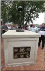  ?? NWA Democrat-Gazette/ FLIP PUTTHOFF ?? People gather Tuesday around the Springdale Fallen Soldier Memorial after a ceremony. The memorial honors soldiers from Springdale who have died in battle since World War I.