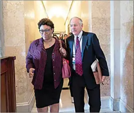  ?? J. SCOTT APPLEWHITE / AP ?? Shalanda Young, director of the Office of Management and Budget, left, and Steve Ricchetti, counselor to the president, the top negotiator­s for President Joe Biden on the debt limit crisis, head for the exit after talks with House Speaker Kevin McCarthy’s emissaries came to an abrupt halt, at the Capitol in Washington on Friday.