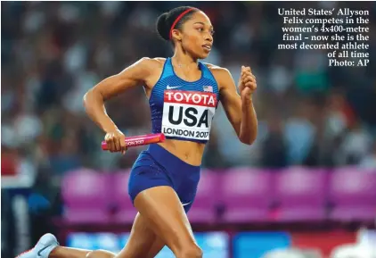  ??  ?? United States’ Allyson Felix competes in the women’s 4x400-metre final – now she is the most decorated athlete of all time Photo: AP