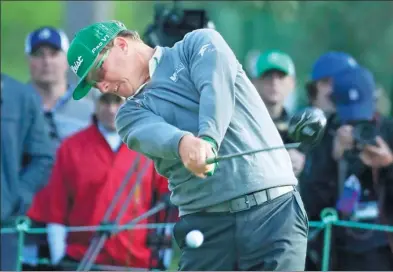  ?? CHRIS CARLSON / AP ?? Charley Hoffman blasts his drive on the 18th hole in Thursday’s opening round of the Masters in Augusta, Georgia.