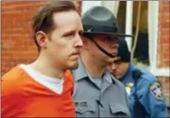  ?? THE ASSOCIATED PRESS ?? Eric Frein is escorted by police out of the Pike County Courthouse on Oct. 31, 2014, after his arraignmen­t in Milford, Pa.