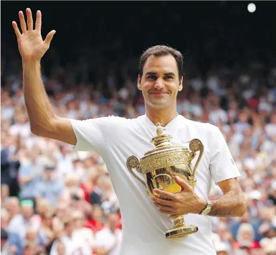  ?? CLIVE BRUNSKILL/GETTY IMAGES ?? Roger Federer celebrates after winning the Wimbledon men’s singles final on Sunday in London. The win gave Federer his eighth Wimbledon title.