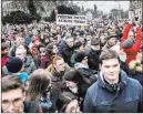  ?? Marko Erd ?? The Associated Press Protesters hold a banner reading “I do care about it” during a mass quiet march Friday in Bratislava, Slovakia.