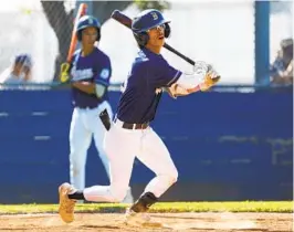  ?? K.C. ALFRED U-T ?? Bonita Vista High’s Luis Sosa slices a double into the right-field corner to drive in three runs in a Division I playoff victory over Madison on Tuesday afternoon.