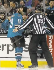  ?? JEFF CHIU/ASSOCIATED PRESS ?? The Sharks’ Joe Thornton (19) is escorted off the ice after being ejected for a game misconduct penalty Saturday.