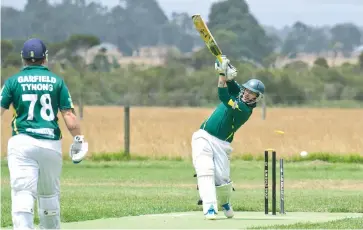  ??  ?? Garfield-Tynong’s Matthew Dodman looks to drive down the ground, but instead, loses his off stump to Jack Pandolfo on Saturday.