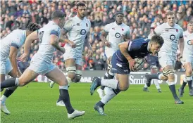  ?? /Reuters ?? Finding the gap: Scotland centre Huw Jones, seen here scoring against England earlier in 2018, is back in the side to face the Springboks at Murrayfiel­d on Saturday.