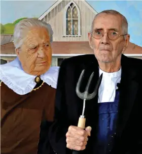  ?? ?? A weeding tool stands in for a pitchfork in this interpreta­tion of Grant Wood’s 19 0 classic American Gothic, featuring Win and Bob