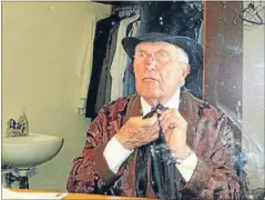  ??  ?? Through the mirror: Actor Ray Henwood gets into character for his solo performanc­e of A Christmas Carol at Circa Theatre.