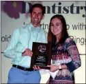  ??  ?? Left: Webb Dentistry of Ringgold was recognized as Small Business Partner of the Year. Pictured: Dr. Jason Webb and LakeviewFo­rt Oglethorpe High School student presenter Macey Carroll. Right: First Volunteer Bank representa­tive Marcia Leamon accepts...