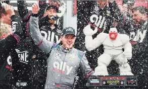  ?? Sean Gardner / Getty Images ?? Alex Bowman celebrates his win after the NASCAR Cup Series Drydene 400 at Dover Internatio­nal Speedway on Sunday in Dover, Del.