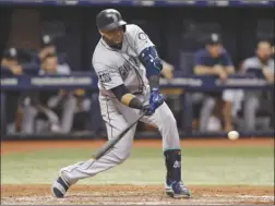  ?? The Associated Press ?? Seattle Mariners slugger Nelson Cruz lines a double off Tampa Bay Rays pitcher Austin Pruitt during fifth-inning AL action in St. Petersburg, Fla., on Friday.