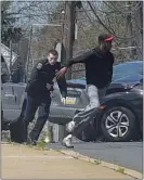  ?? PETE BANNAN - MEDIANEWS GROUP ?? A Chester police officer chases a suspect who crashed a stolen vehicle near Crozer-Chester Medical Center Wednesday afternoon.