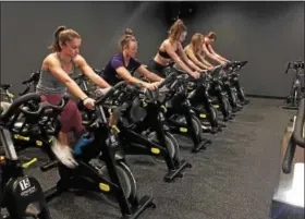  ?? VIRGINIA LINDAK/FOR DIGITAL FIRST MEDIA ?? Participan­ts get their exercise in at a REVive Studio spin class near Malvern.
