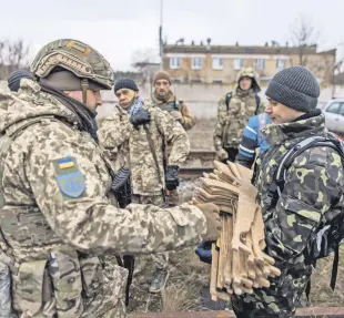  ?? ?? Reservists take part in tactical training and individual combat skills conducted by the Territoria­l Defense of the Capital in Kyiv, Ukraine, Feb. 19, 2022.