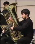  ?? The Sentinel-Record/Richard Rasmussen ?? HITTING THE NOTES: Joshua Harris plays the tuba during a performanc­e by the Gentry High School Wind Ensemble at Bank of the Ozarks Arena on Thursday.