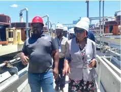  ?? ?? Minister of State for Matabelela­nd South Provincial Affairs and Devolution Dr Evelyn Ndlovu (right) is taken on a tour of Gwanda Lithium Mine in Mandihongo­la area by the mine’s public relations manager Mr Nickson Kutsaranga recently