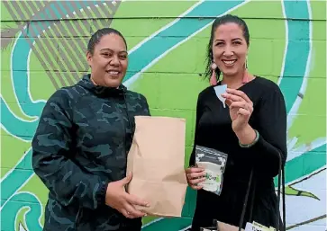  ??  ?? Season-Mary Downs delivers menstrual cups to Vai Lopeti from He Iwi Kotahi Tatau Trust in Moerewa.