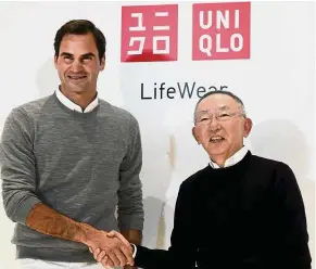  ?? — AFP ?? Tennis icon: Roger Federer and Yanai during a photo session at the Fast Retailing headquarte­rs in Tokyo recently.