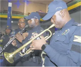  ?? (Photo: Naphtali Junior) ?? Members of the JCF Band Division, Aldraw Merchant (left) and Romayne Ross perform at last Thurday’s expo at the National Arena in St Andrew.