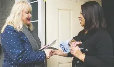  ?? GERRY KaHRMANN ?? South Surrey-White Rock Conservati­ve candidate Kerry-Lynne Findlay, left, meets Eva Bai while door knocking on Tuesday.