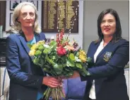  ?? ?? Fermoy Golf Club lady captain Siobhan Feehan presenting ex officio Oonagh Mee with a bouquet of flowers following the recent AGM in Fermoy GC.