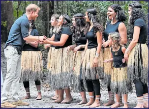  ??  ?? The Prince greets local girls during a plaque unveiling on Fraser Island